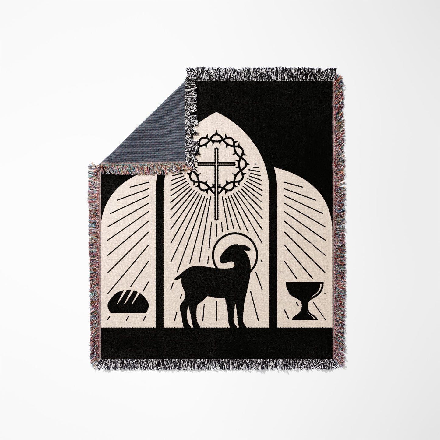Black throw blanket with Christian symbols: lamb, crown of thorns, cross, bread, and chalice.
