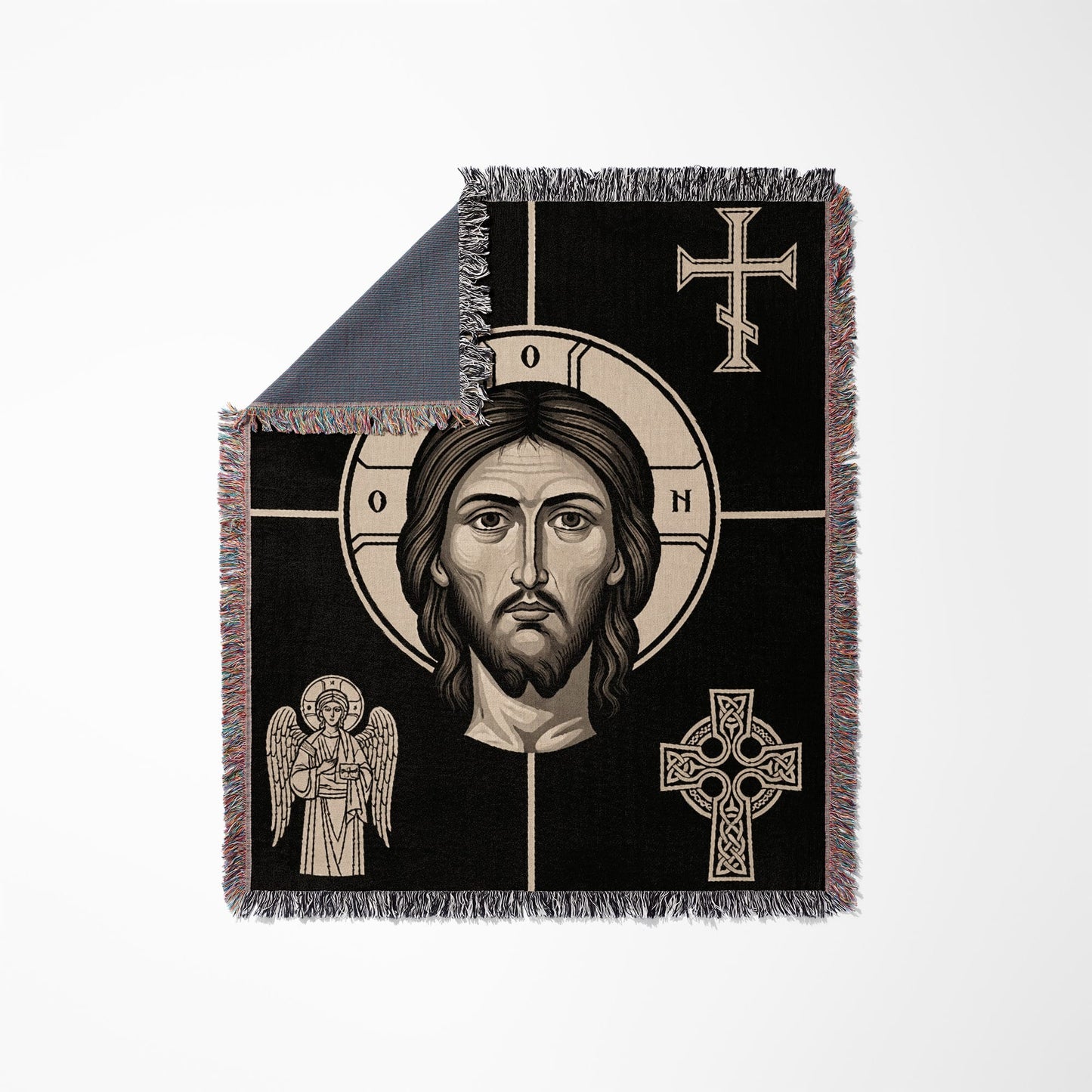 Icon of Jesus' face on a black woven blanket with fringe.