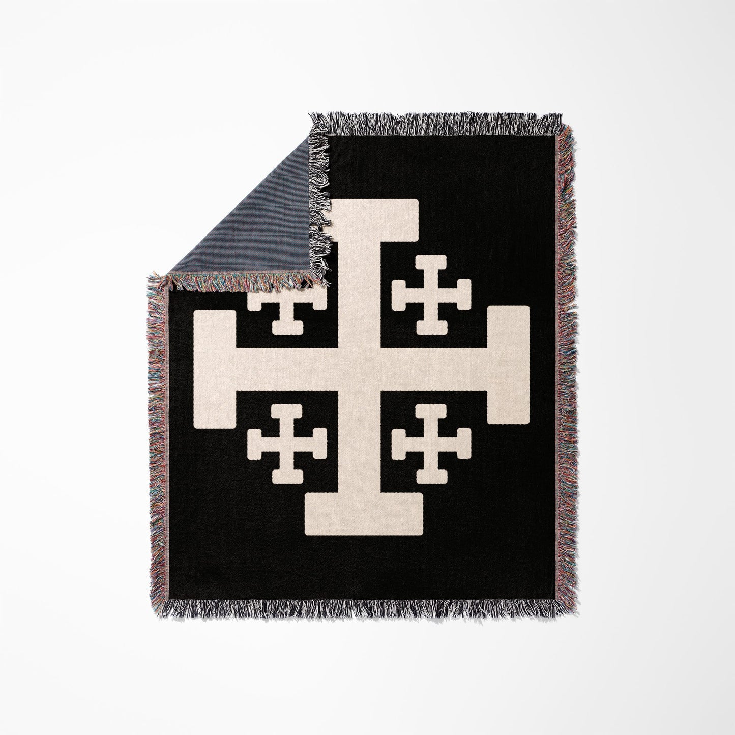 Black throw blanket with a cream-colored Crusader's Cross design and fringed edges.