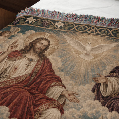 Woven tapestry throw blanket featuring Jesus, a glowing dove, and decorative floral borders with fringe.