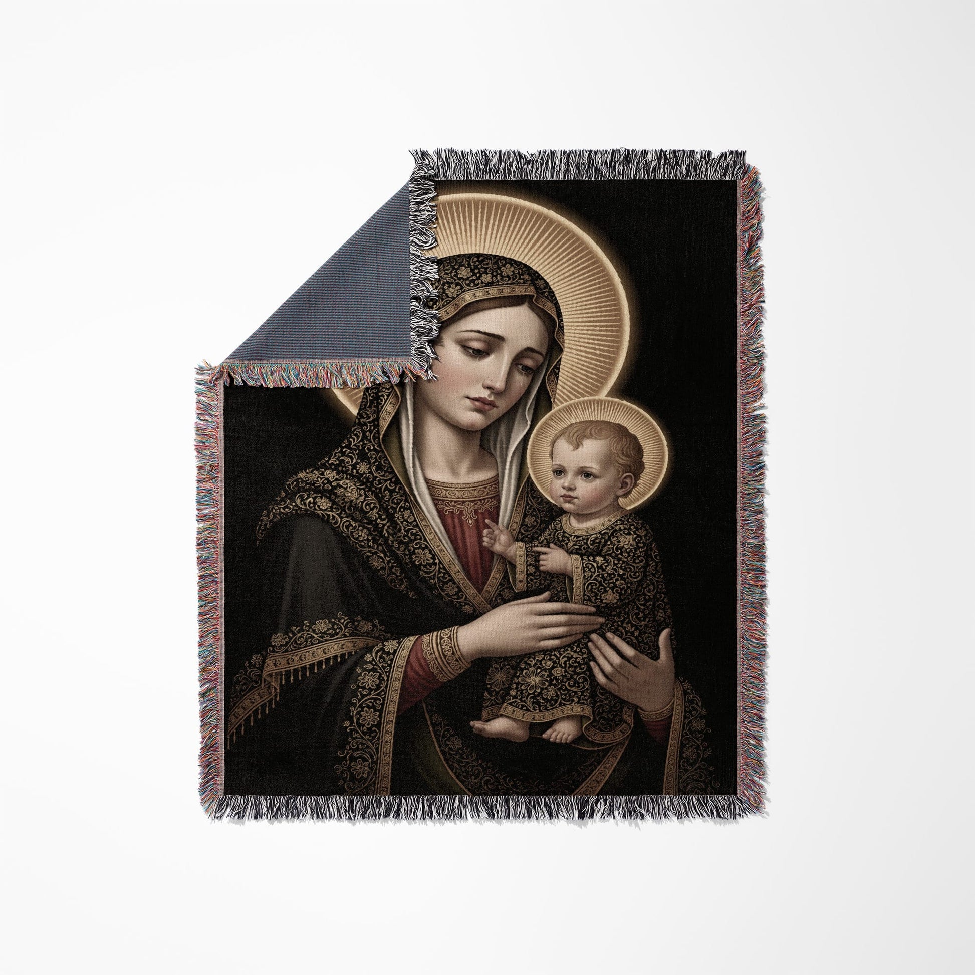 Tapestry blanket featuring Madonna and Child artwork with gold halo detail.