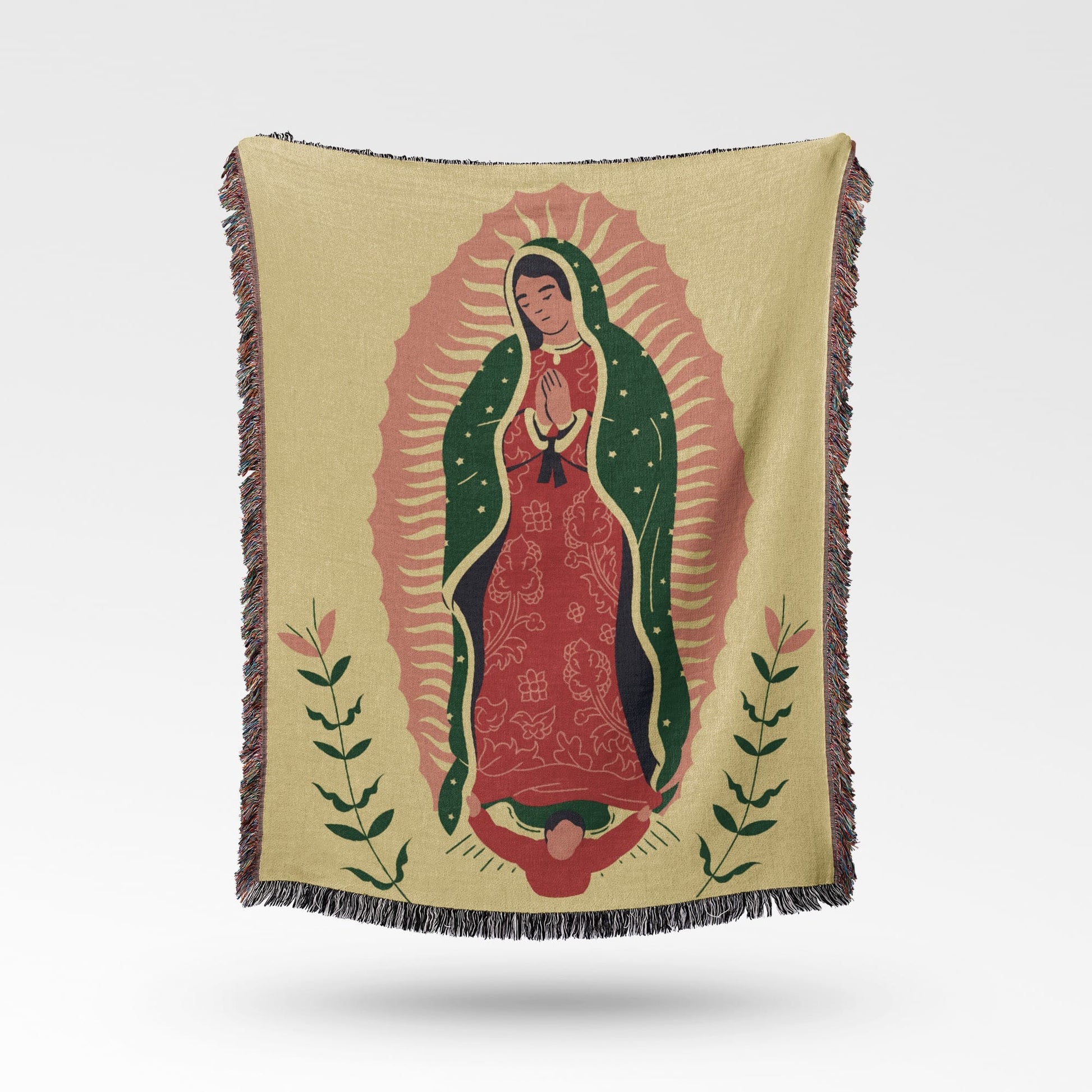 Woven blanket with a depiction of the Virgin of Guadalupe on a pale yellow background.