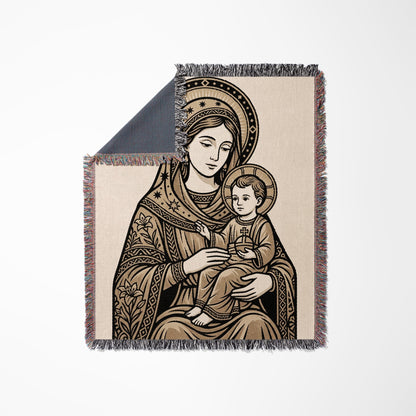 Religious blanket featuring Virgin Mary holding baby Jesus.