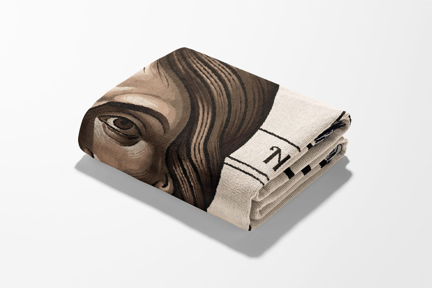 Folded blanket with a close-up portrait of George Washington and text.