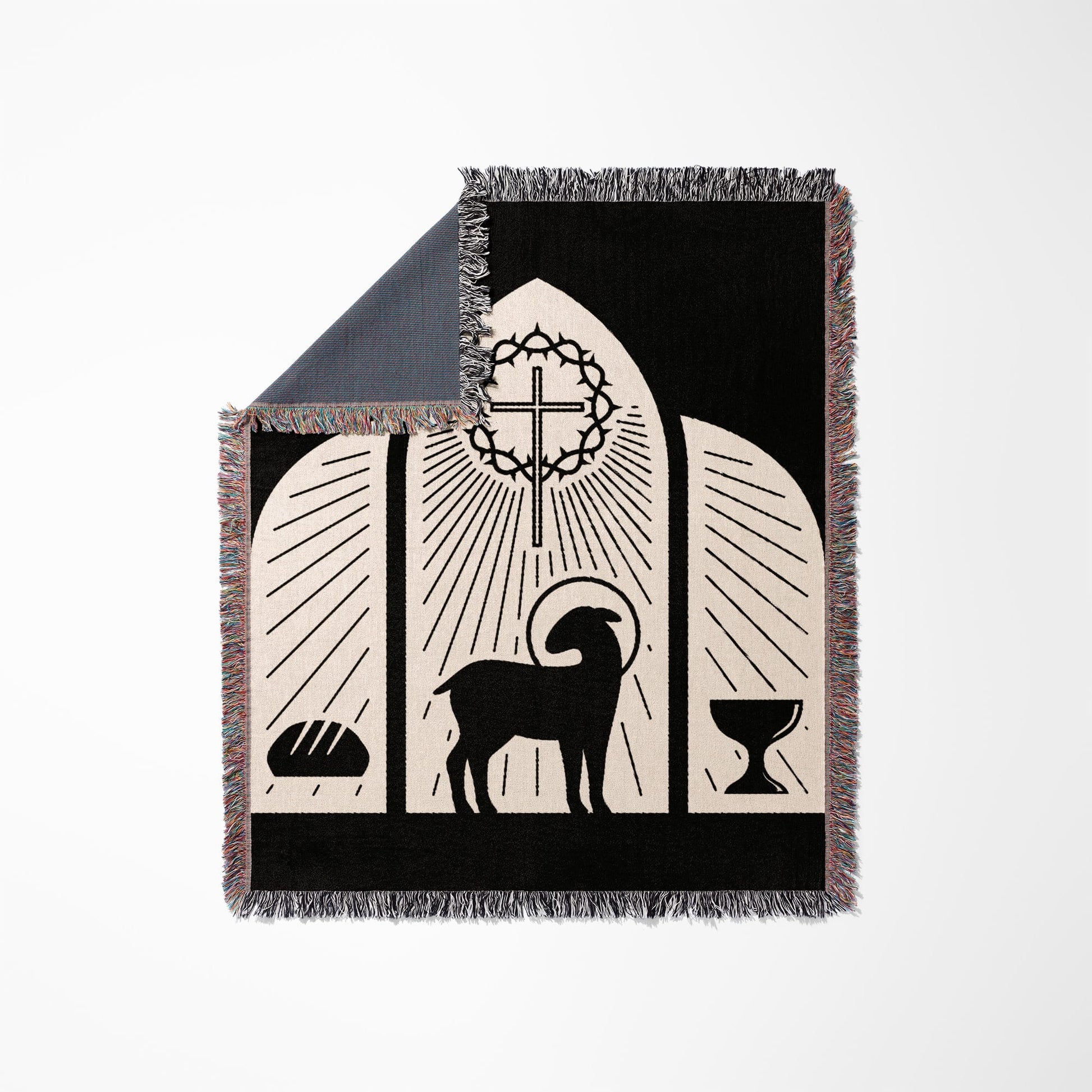 Black throw blanket with Christian symbols: lamb, crown of thorns, cross, bread, and chalice.