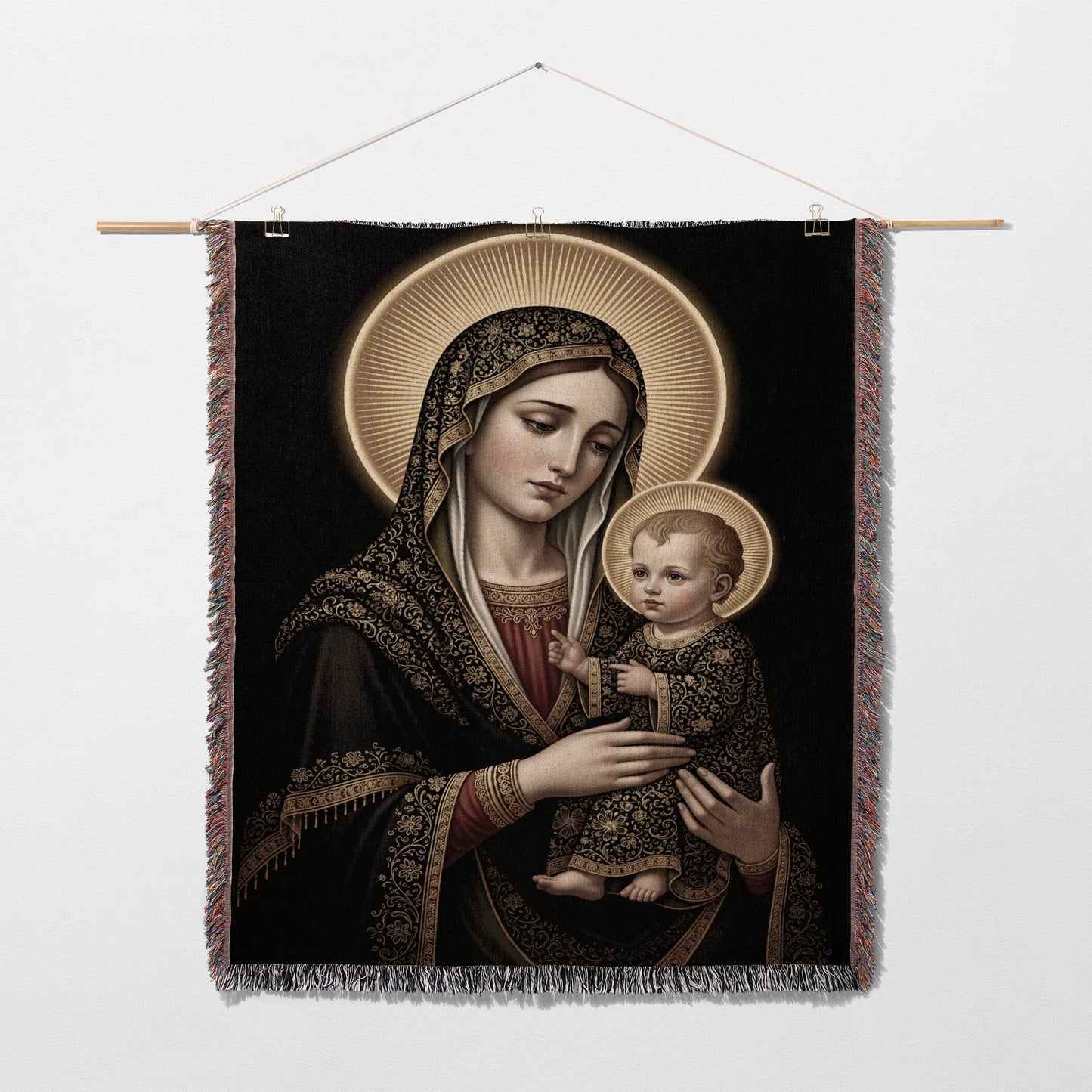 Madonna and Child tapestry with gold halo and ornate black and gold fabric.