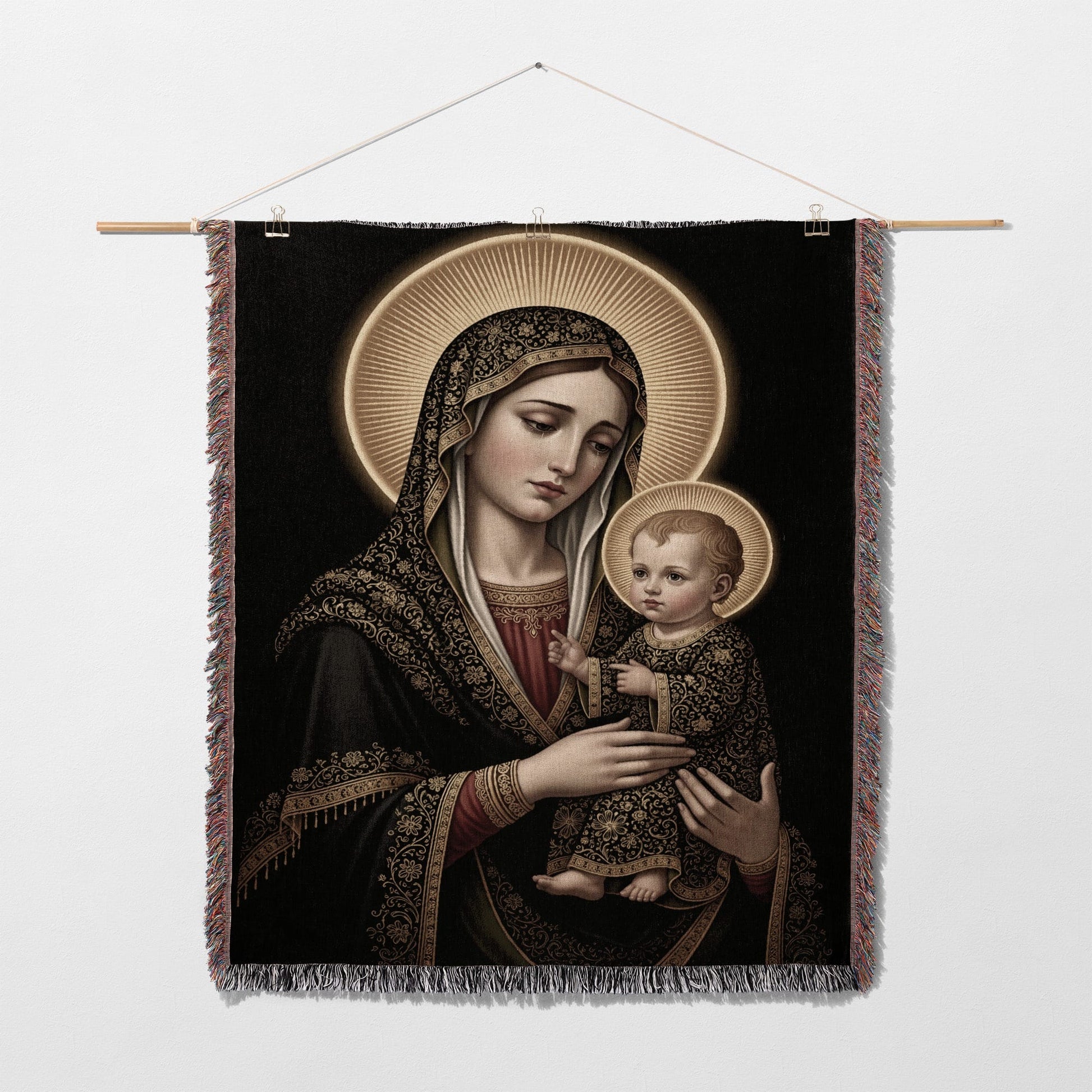 Madonna and Child tapestry with gold halo and ornate black and gold fabric.