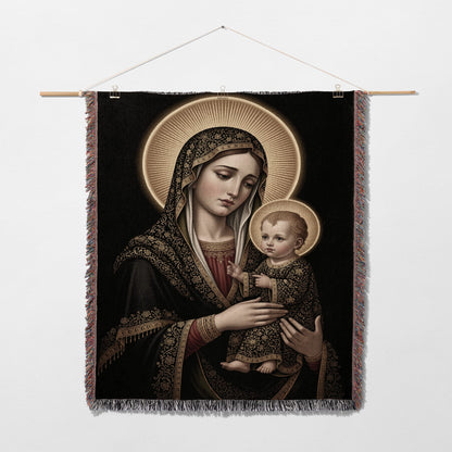Madonna and Child tapestry with gold halo and ornate black and gold fabric.