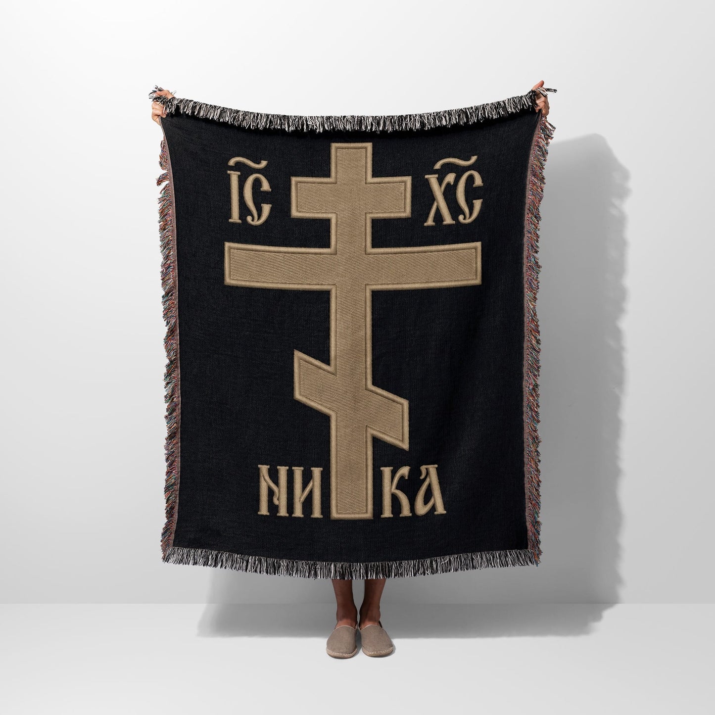 Black throw blanket with gold Orthodox Christian cross and text.