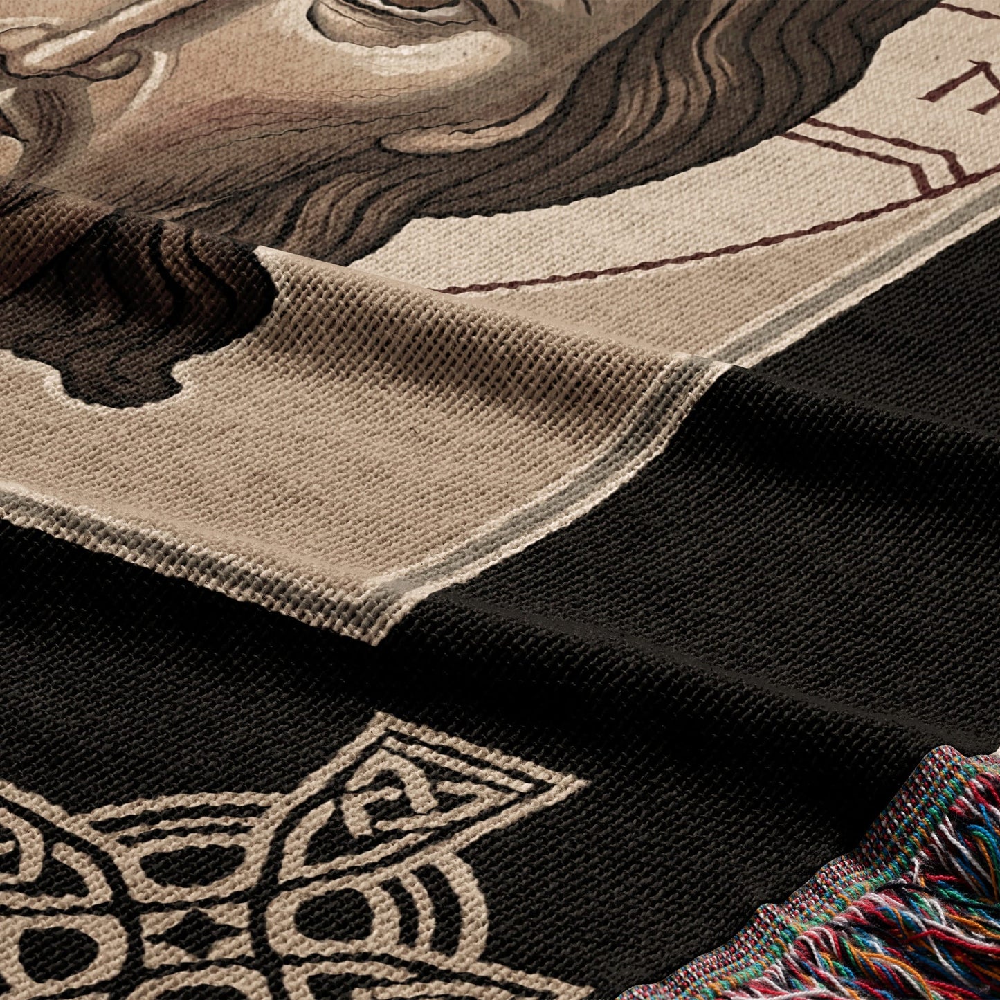 Woven tapestry with a partial portrait and Celtic knot design.