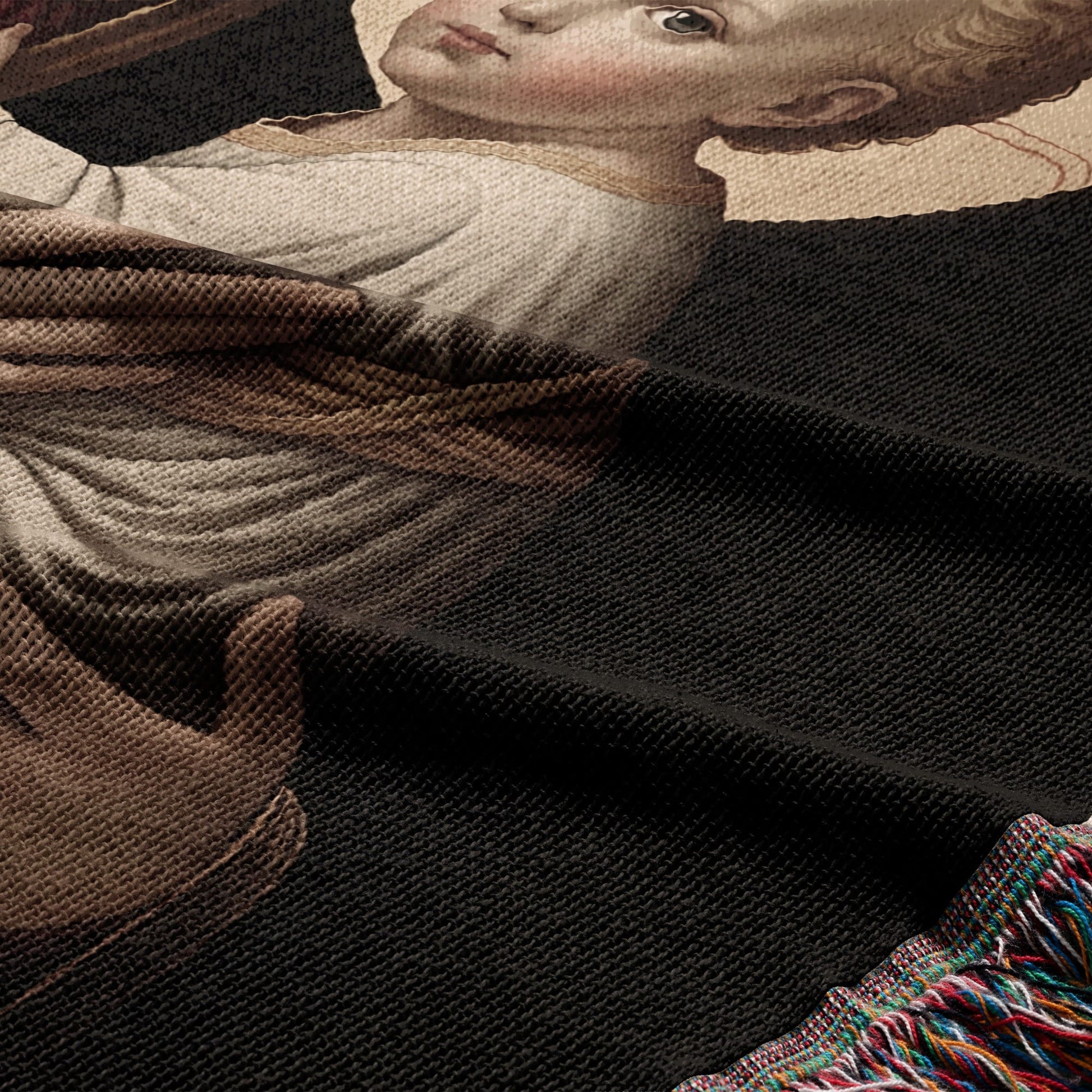 Tapestry depicting a child with brown hair, wearing white, against a dark background.