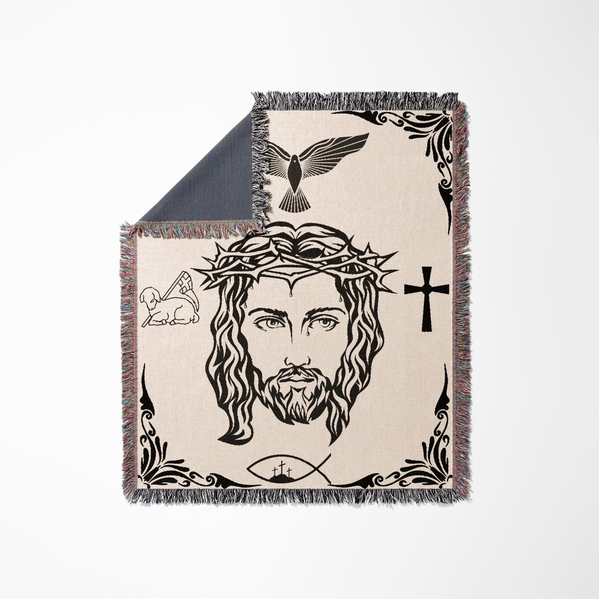 Jesus' face with crown of thorns, lamb, dove, cross, and fish symbol on a blanket.