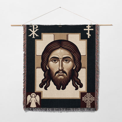 Icon of Jesus Christ with cross and angel motifs on woven tapestry.