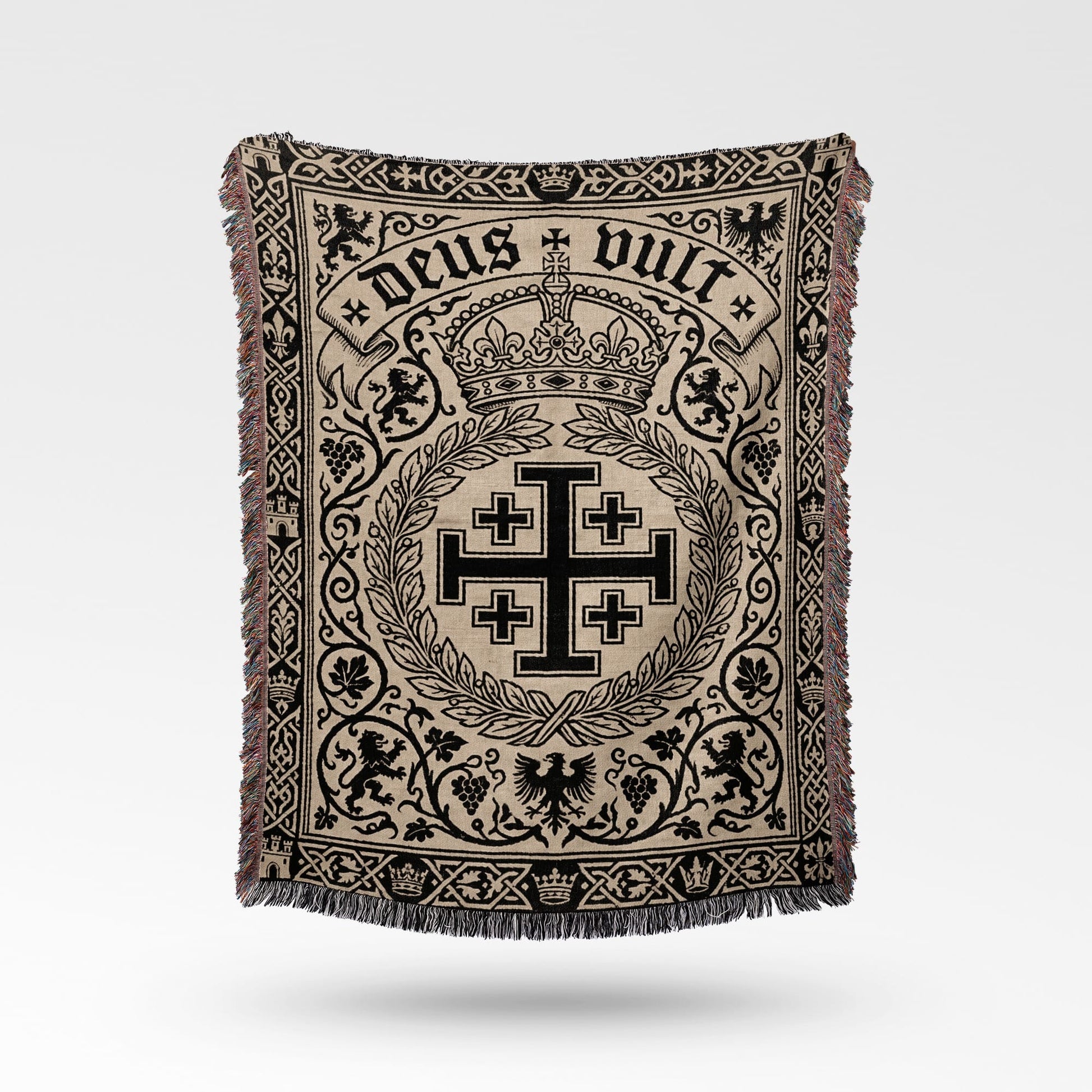 Tapestry blanket featuring "Deus Vult" and a Jerusalem cross emblem.