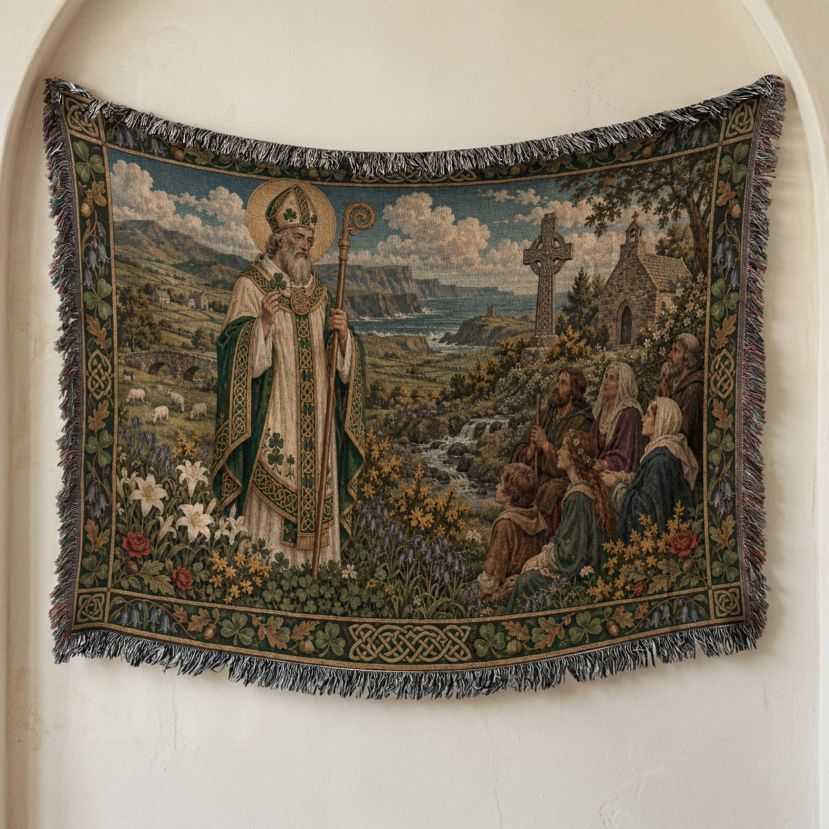 A woven tapestry hanging on a wall depicts Saint Patrick addressing a group of people near an Irish landscape.