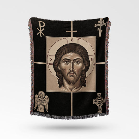 Black woven blanket with Jesus Christ's face and religious symbols.