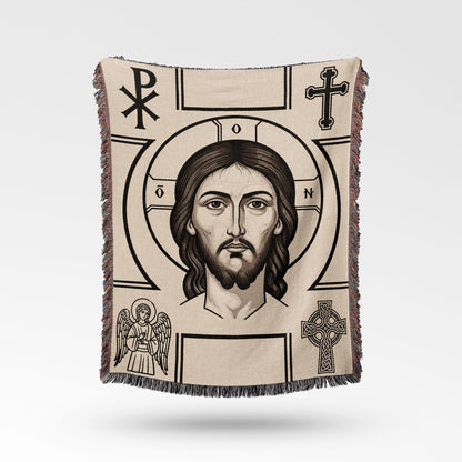 Tapestry featuring a central portrait of Jesus Christ surrounded by religious symbols.