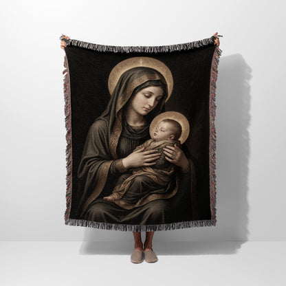 Religious tapestry featuring the Virgin Mary holding the baby Jesus with halos.