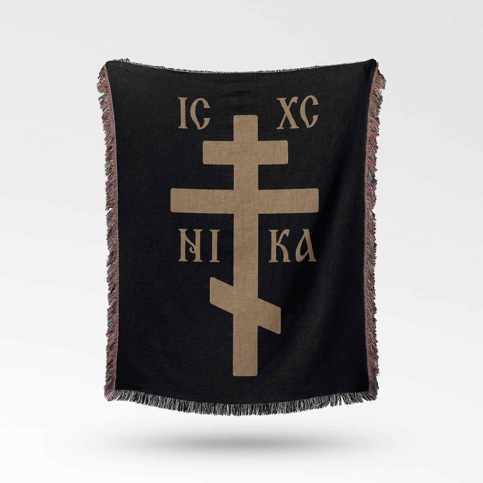 Black throw blanket with a gold Orthodox Christian cross and Greek lettering.