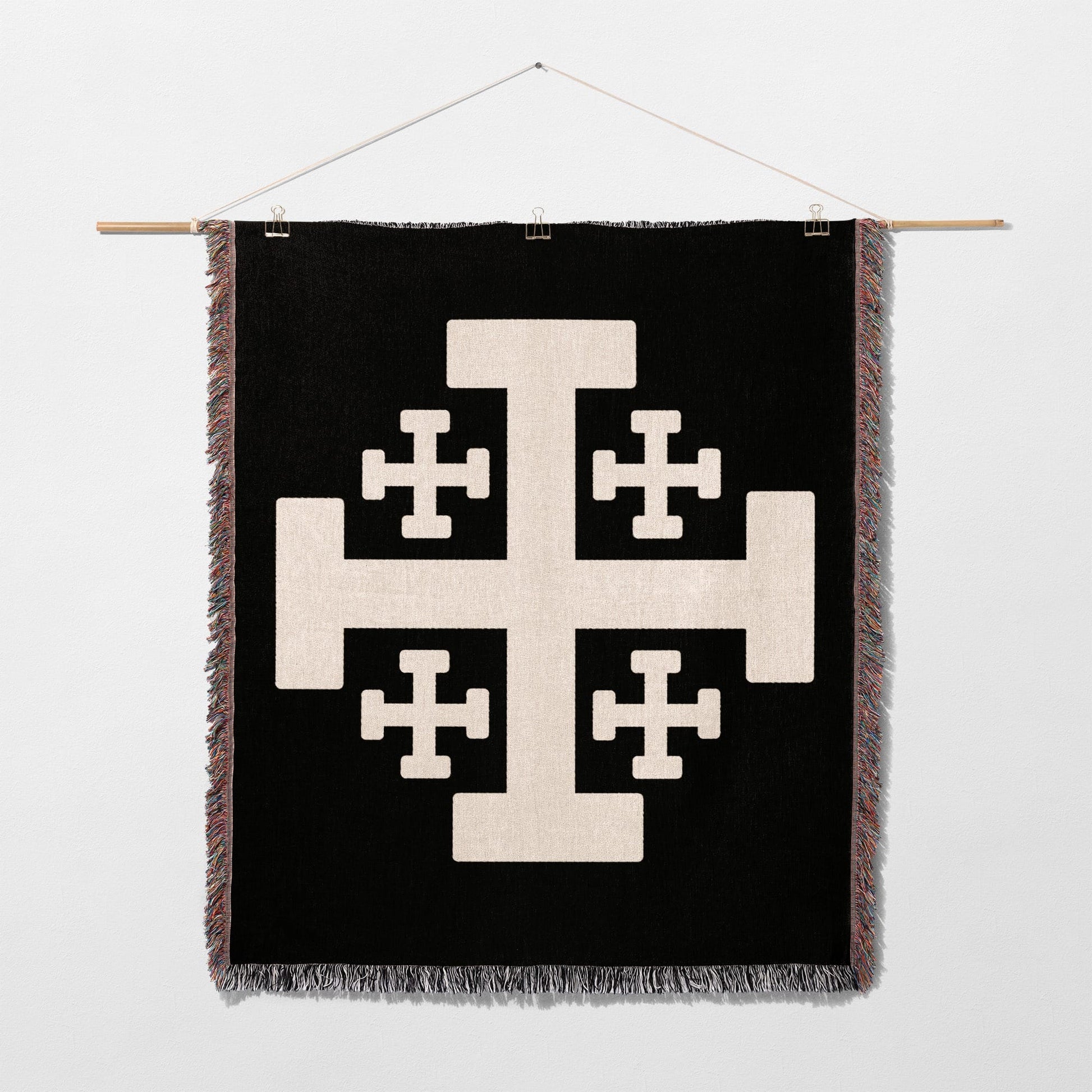 Black tapestry with a large white Crusader's Cross design.