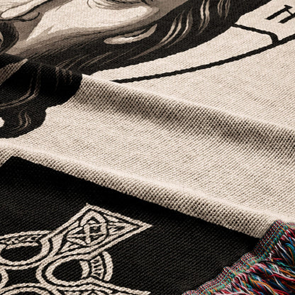 Woven throw with Celtic knot design and a partial portrait.