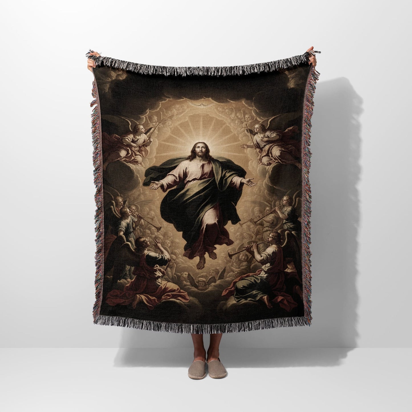 Jesus ascending with angels surrounding him, depicted on a woven blanket.