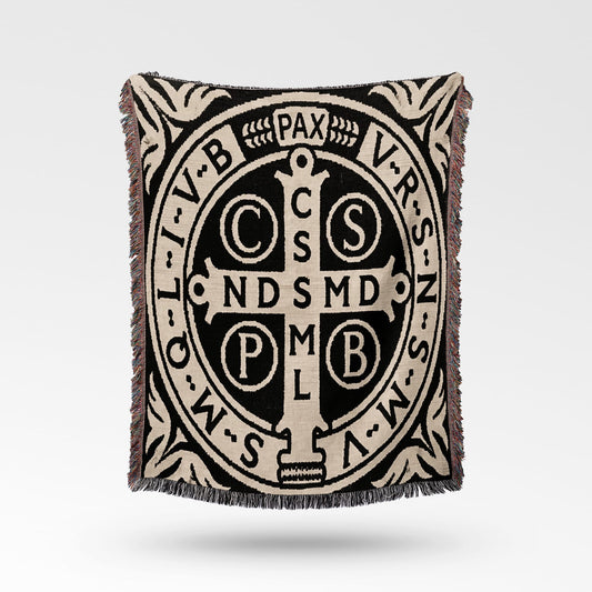 Woven throw with St. Benedict's medal pattern and text.