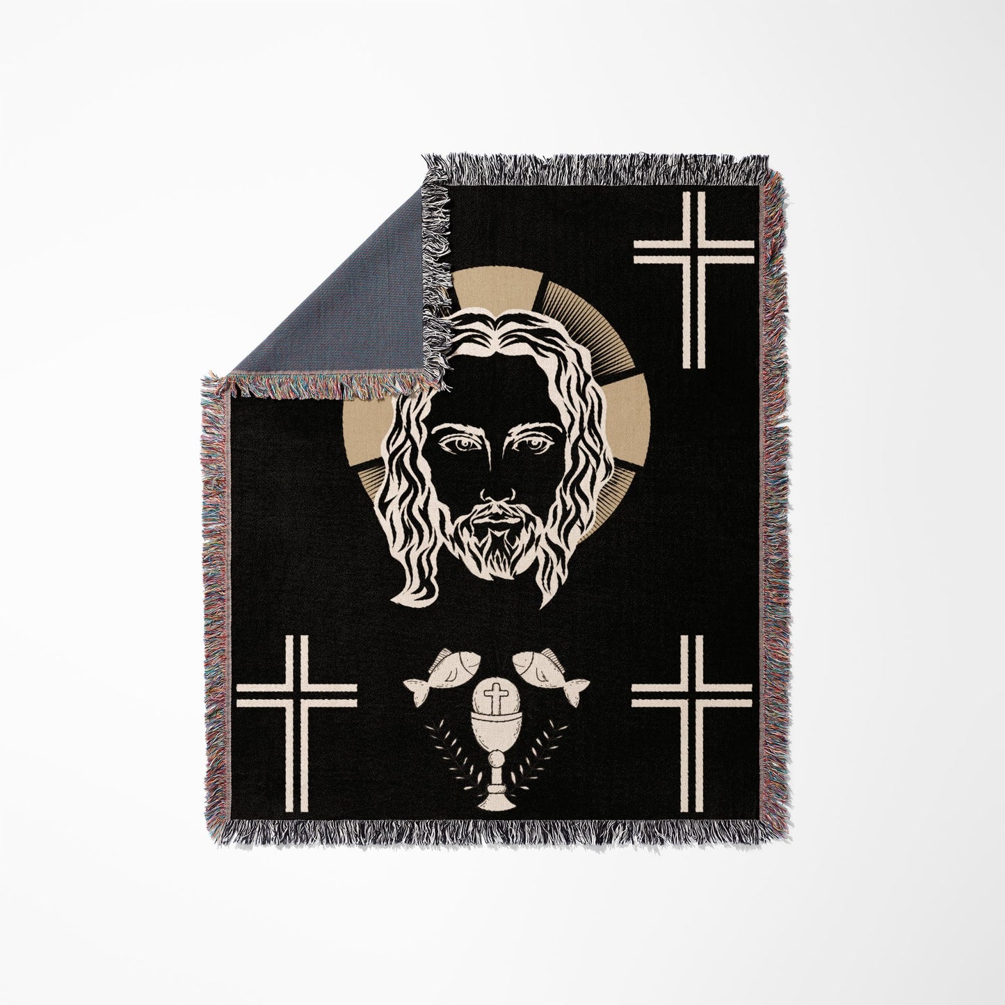 Black woven blanket with image of Jesus' face, crosses, chalice, and fish.
