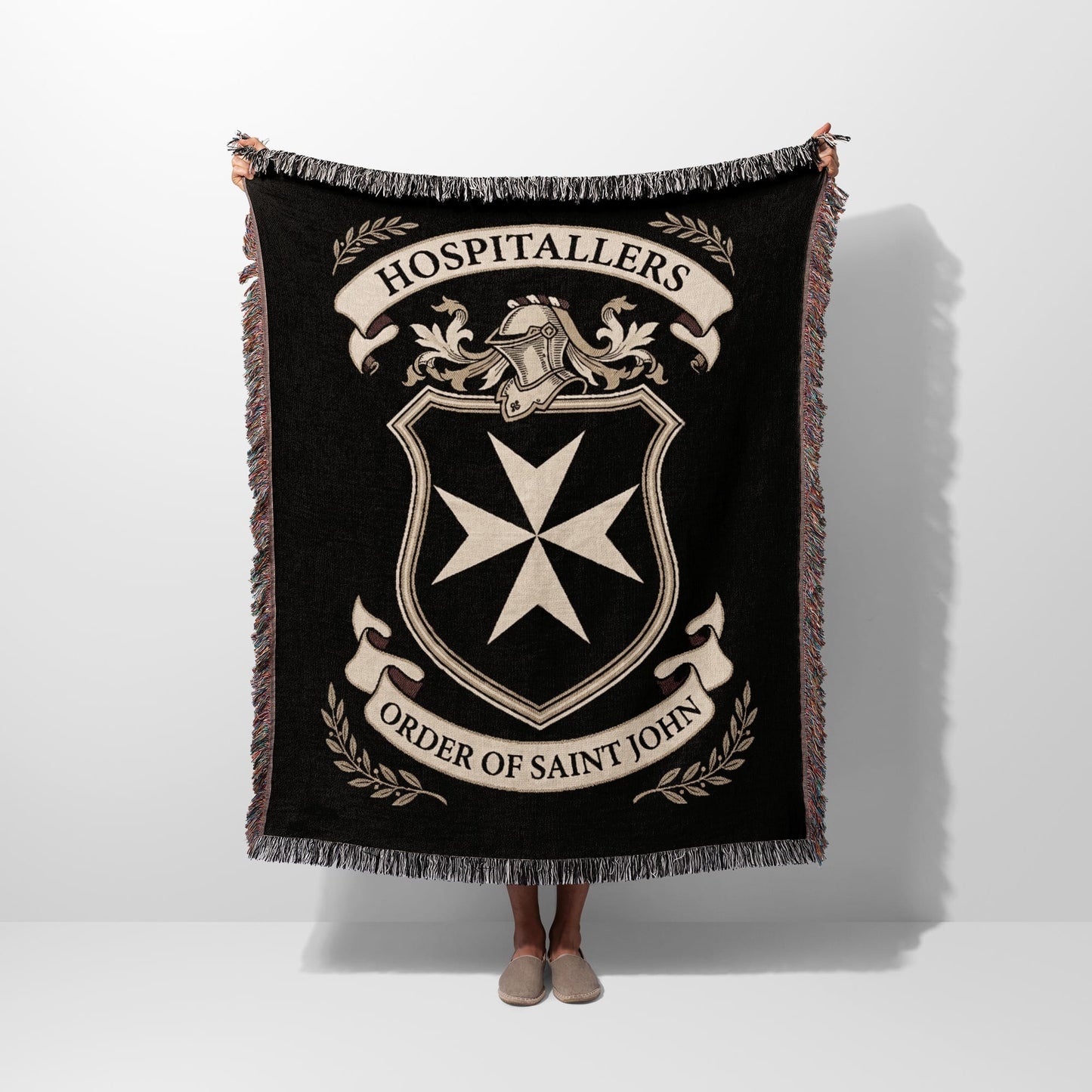 Black blanket with Order of Saint John crest and "Hospitallers" text.
