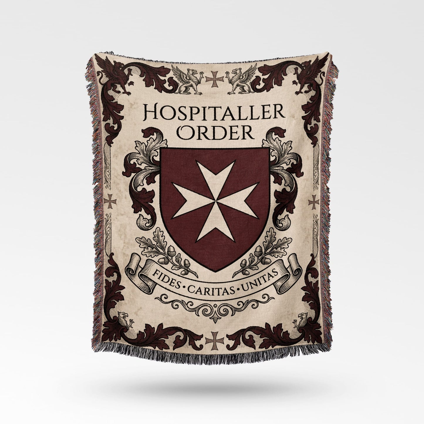 Hospitaller Order crest with Maltese cross and Latin motto on a blanket.