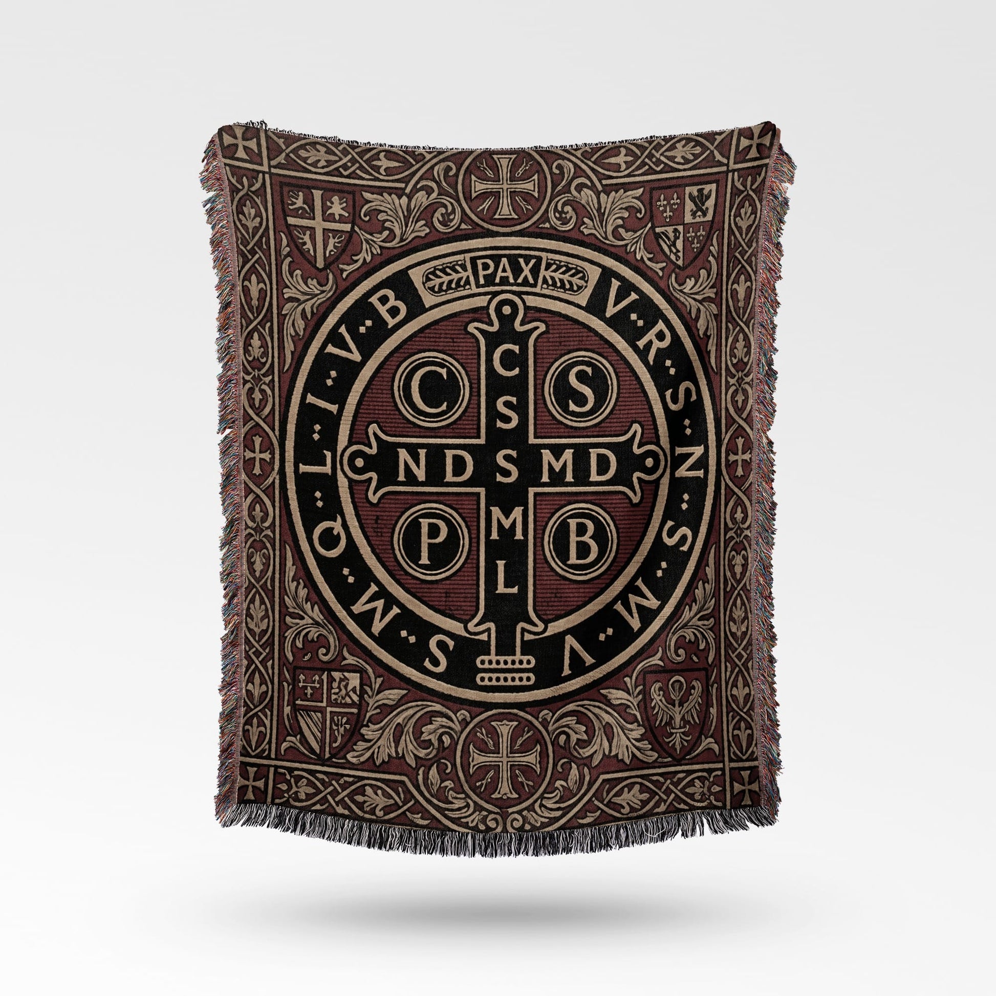 Woven tapestry throw with Benedictine medal design and intricate borders.