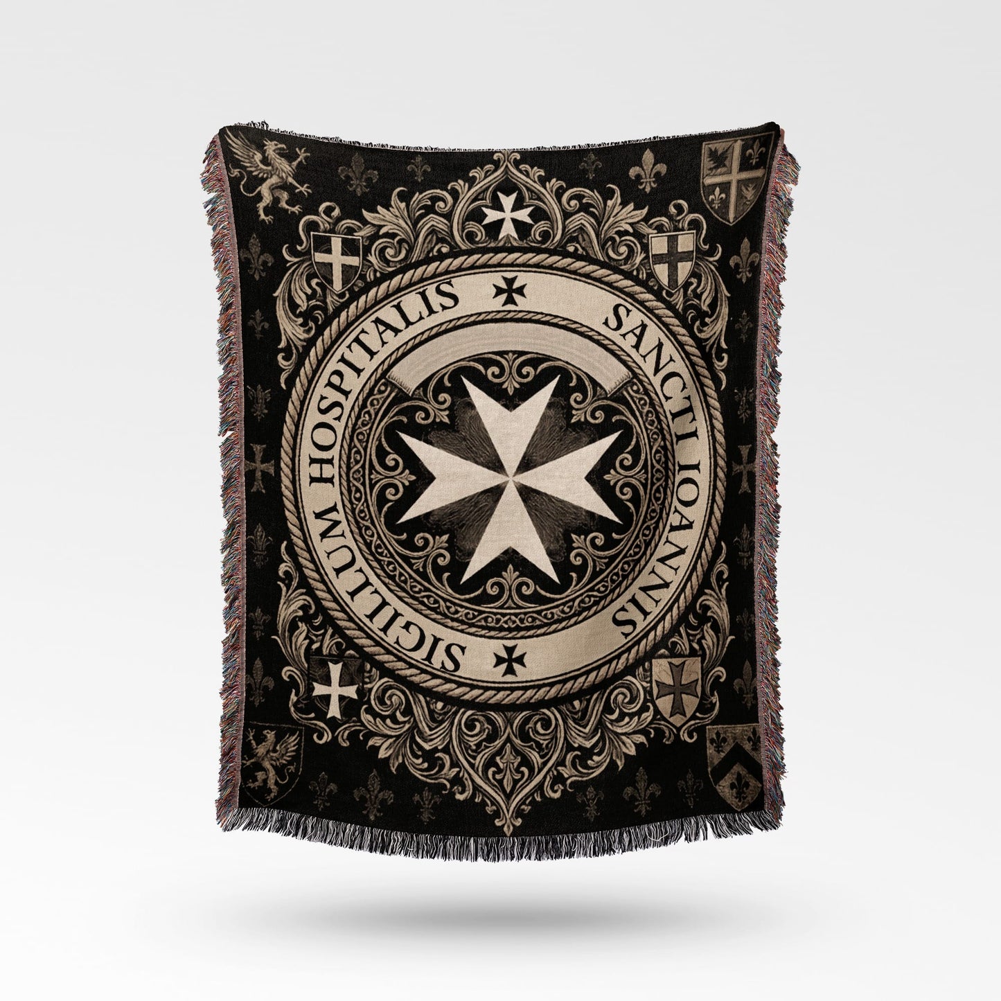 Textile blanket with intricate black and cream medieval design and crests.
