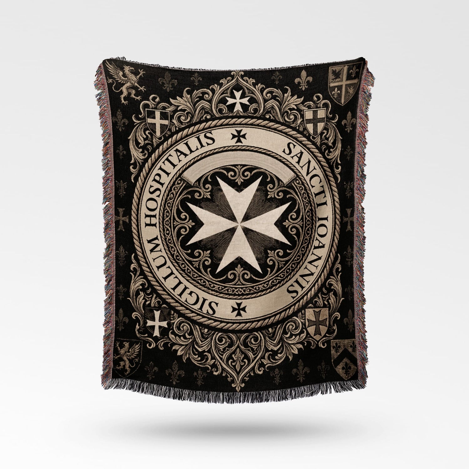 Textile blanket with intricate black and cream medieval design and crests.
