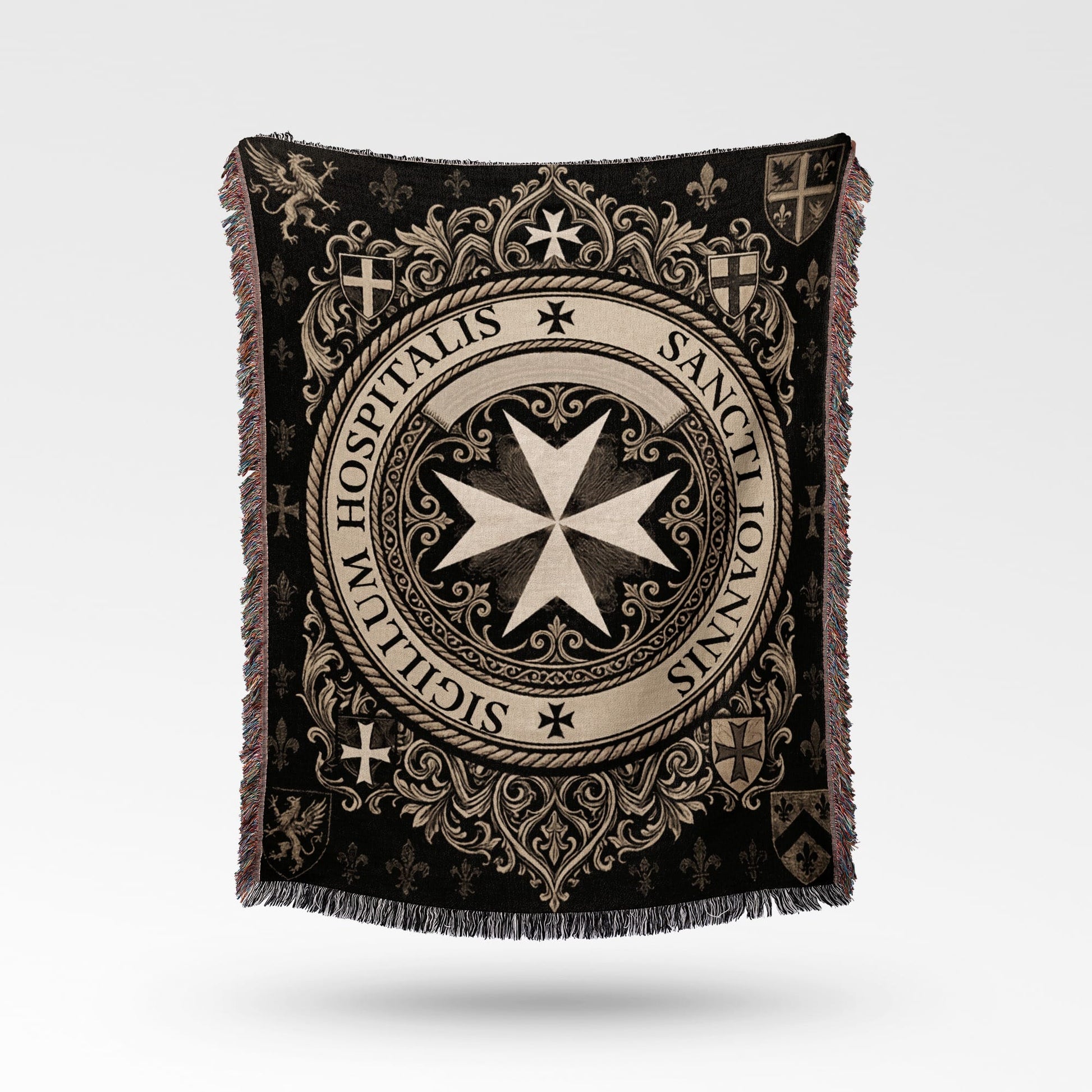 Textile blanket with intricate black and cream medieval design and crests.