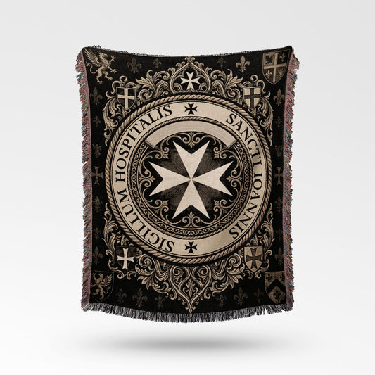 Textile blanket with intricate black and cream medieval design and crests.