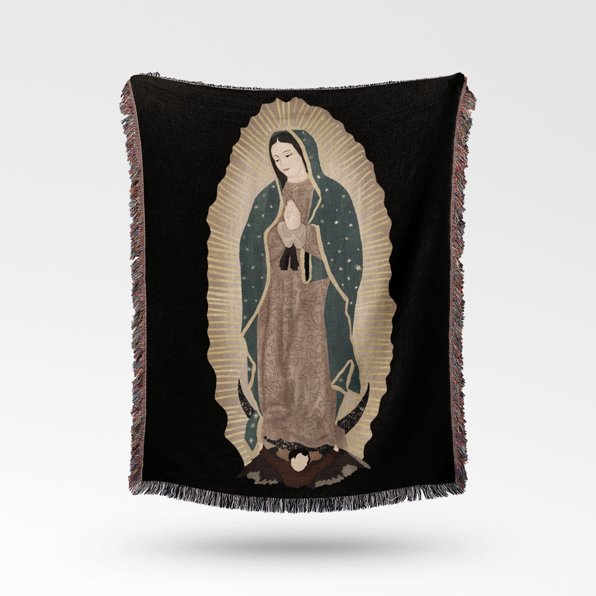 Black throw blanket with an embroidered image of the Virgin of Guadalupe.