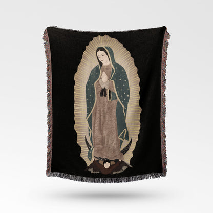 Black throw blanket with an embroidered image of the Virgin of Guadalupe.