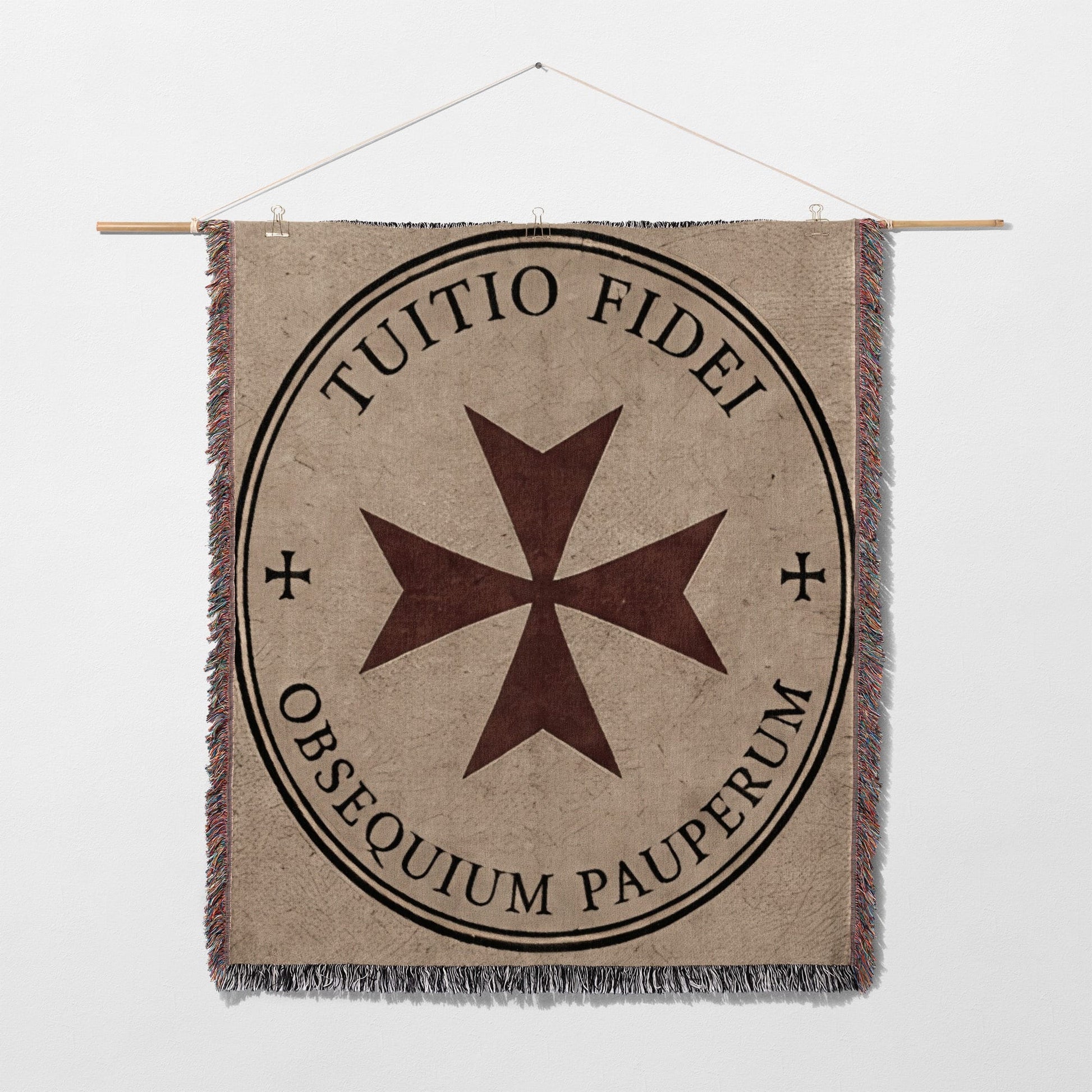 Tapestry with Maltese cross and text "TUTIO FIDEI OBSEQUIUM PAUPERUM"