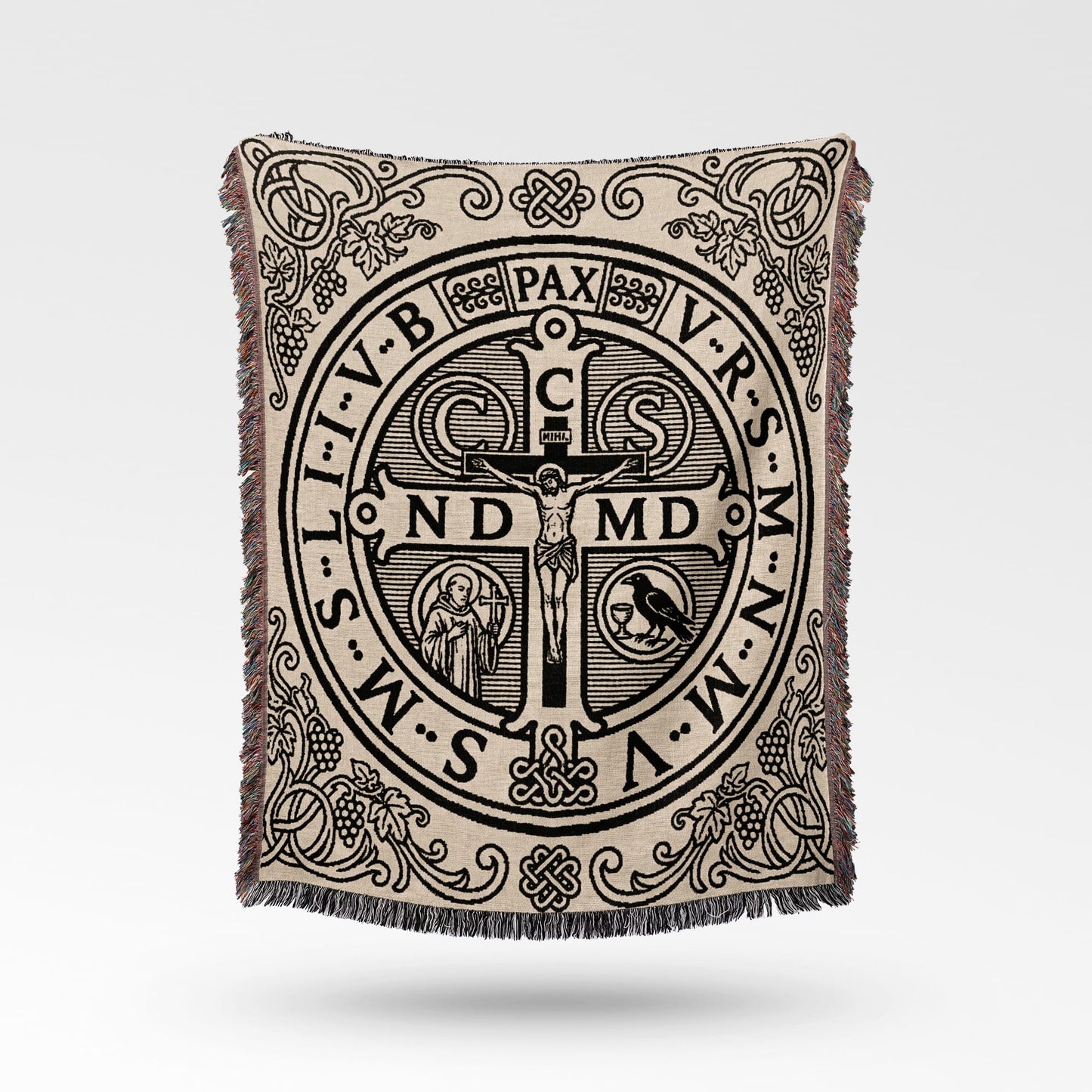 Tapestry throw with St. Benedict medal design and intricate border details.