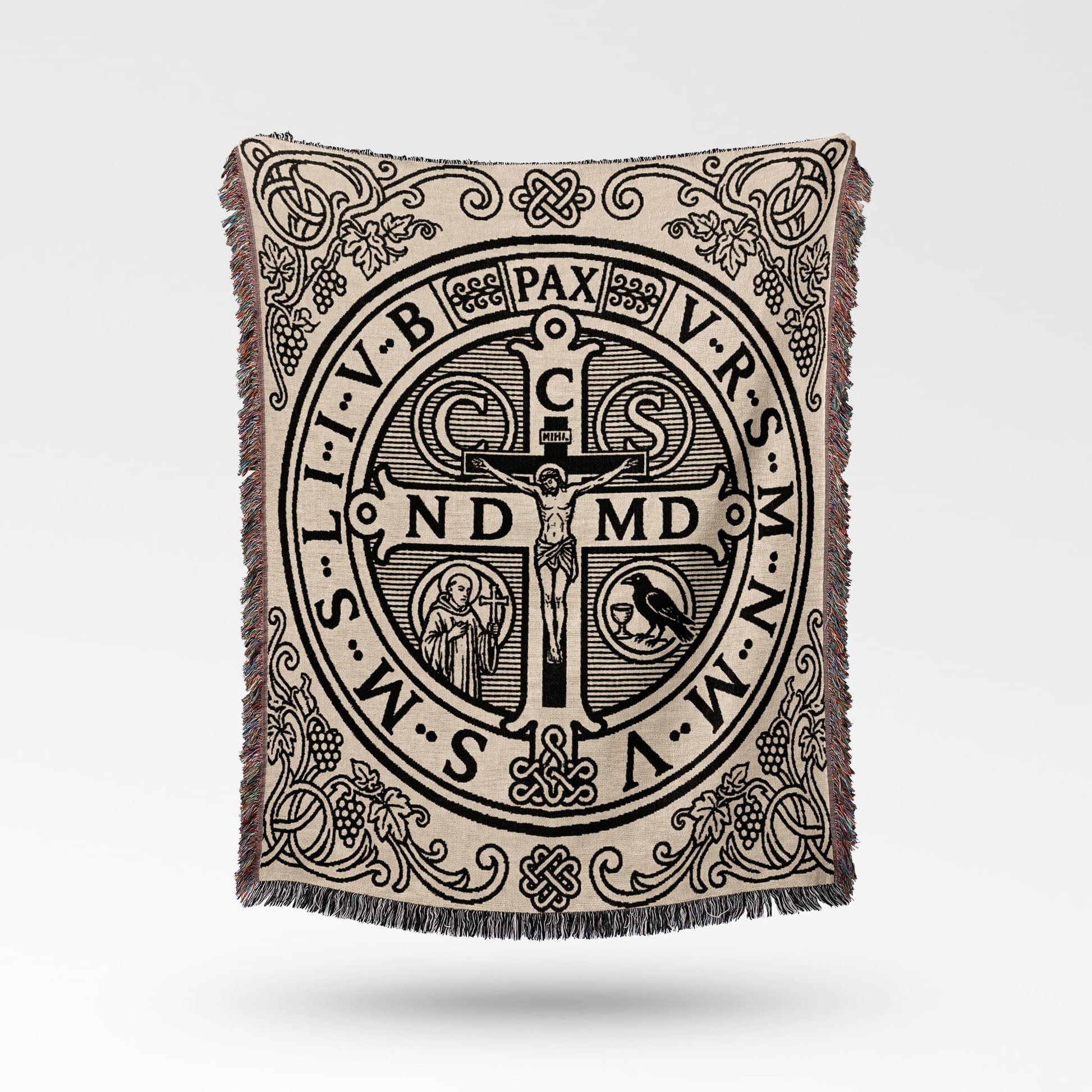 Tapestry throw with St. Benedict medal design and intricate border details.