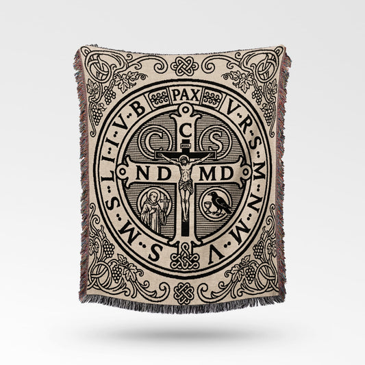 Tapestry throw with St. Benedict medal design and intricate border details.
