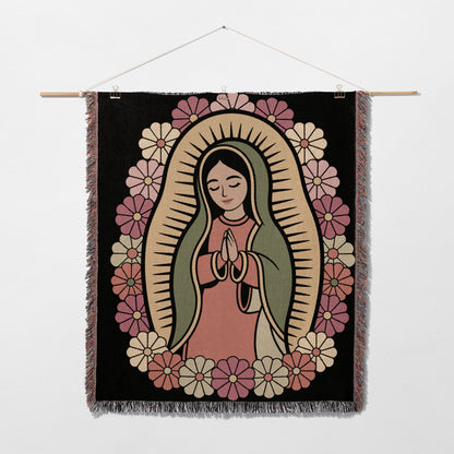 Religious tapestry featuring the Virgin Mary surrounded by flowers.