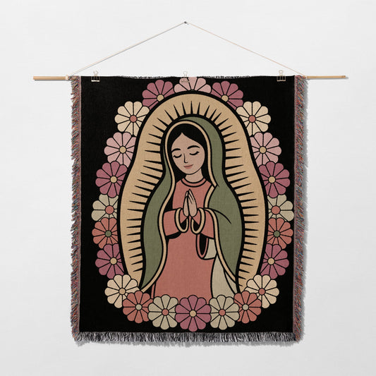 Religious tapestry featuring the Virgin Mary surrounded by flowers.