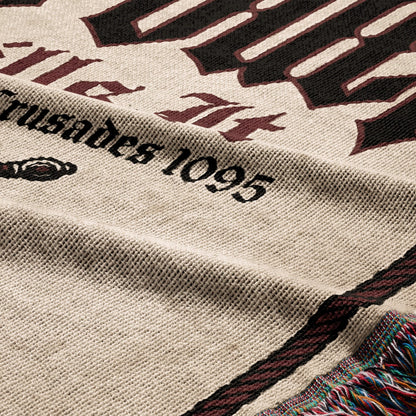 Textured blanket with "Crusades 1095" and gothic lettering.