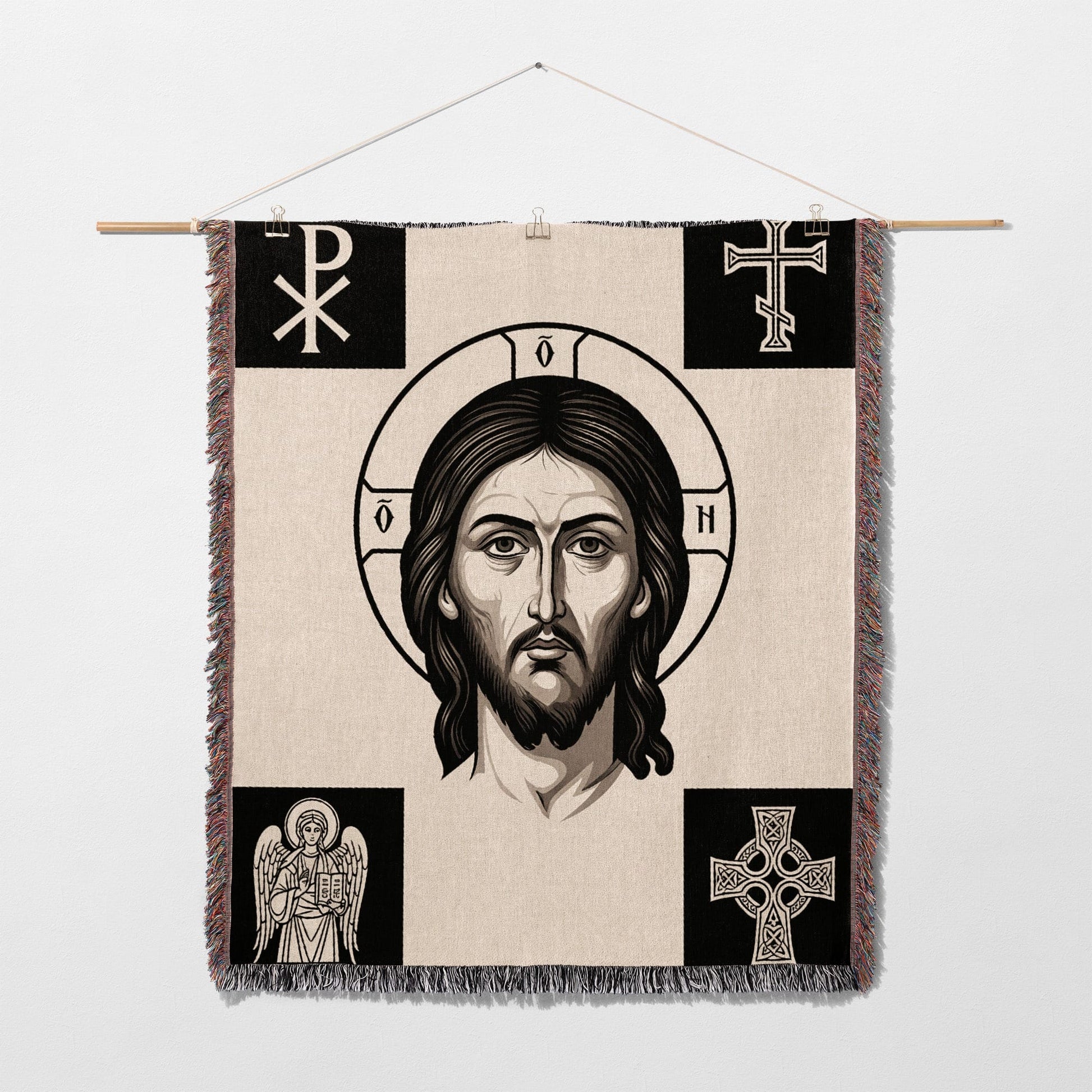 Tapestry featuring Jesus' face, halo, and religious symbols.