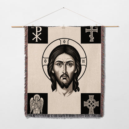 Tapestry featuring Jesus' face, halo, and religious symbols.