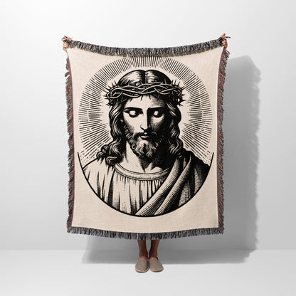 Tapestry blanket featuring a black and white illustration of Jesus wearing a crown of thorns.
