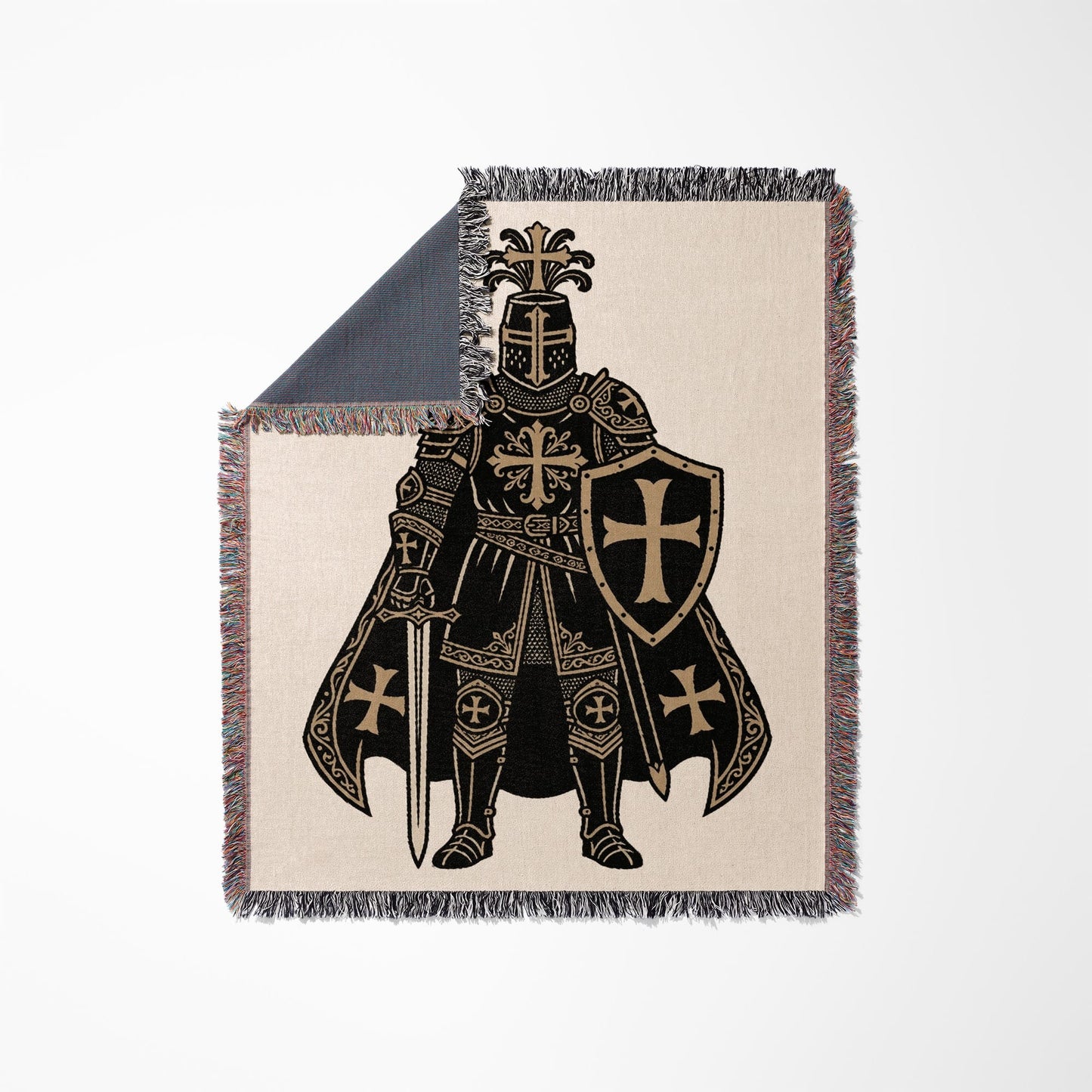 Knight in armor with shield and sword on a patterned blanket.