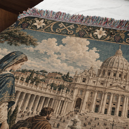 A woven tapestry throw blanket featuring a classical Italian architectural scene with St. Peter's Basilica and fringed edges.
