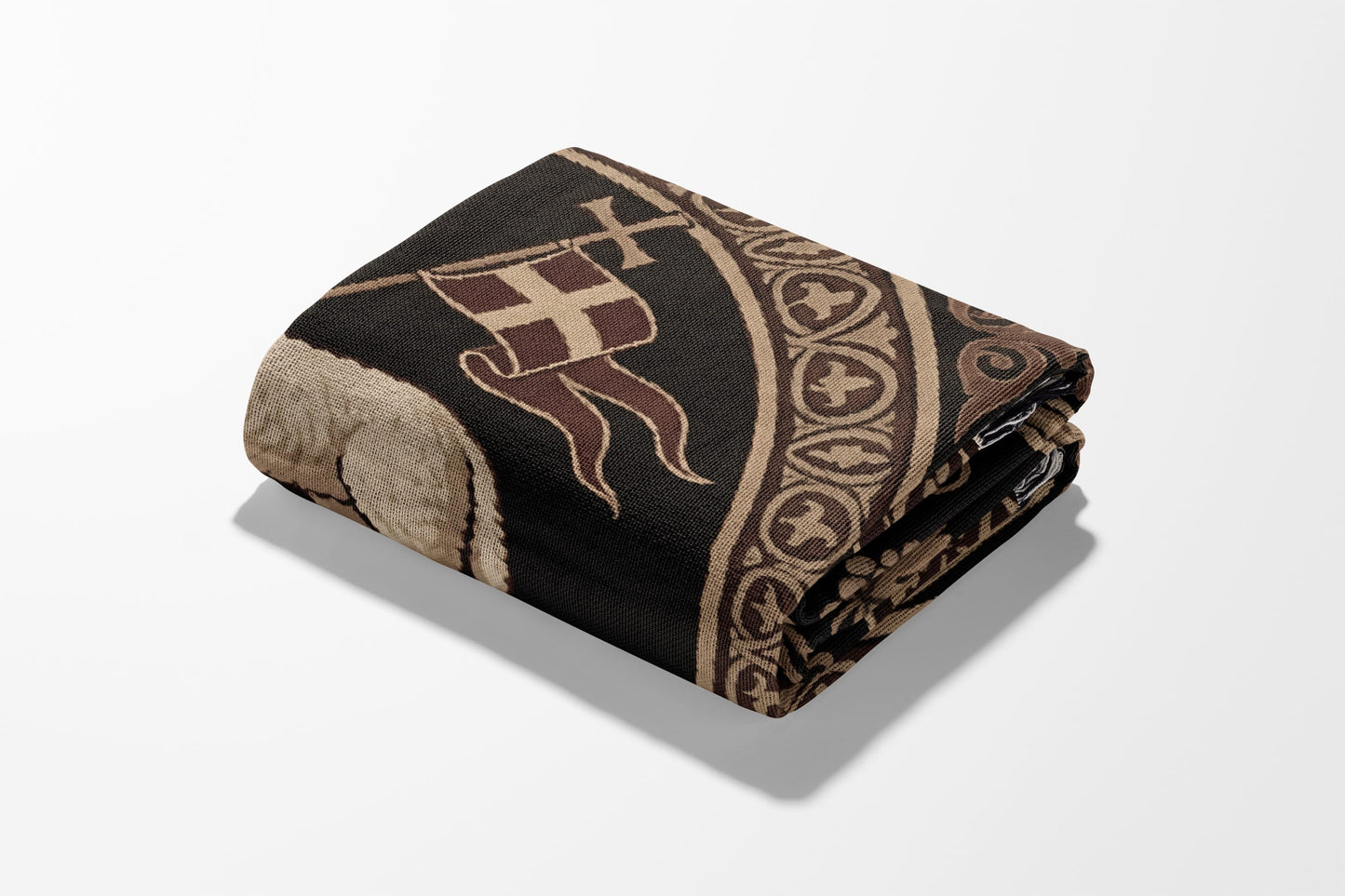 Folded tapestry with medieval cross and banner design on black and tan.